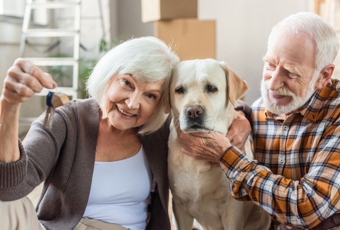 collage of senior couple petting dog and woman holding keys, moving concept