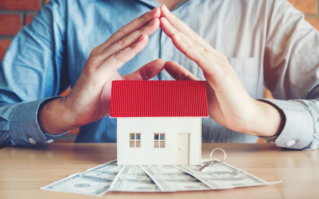 The concept of home ownership and dollars bills
